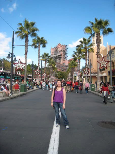 woman standing on main street of Hollywood Studios Theme Park
