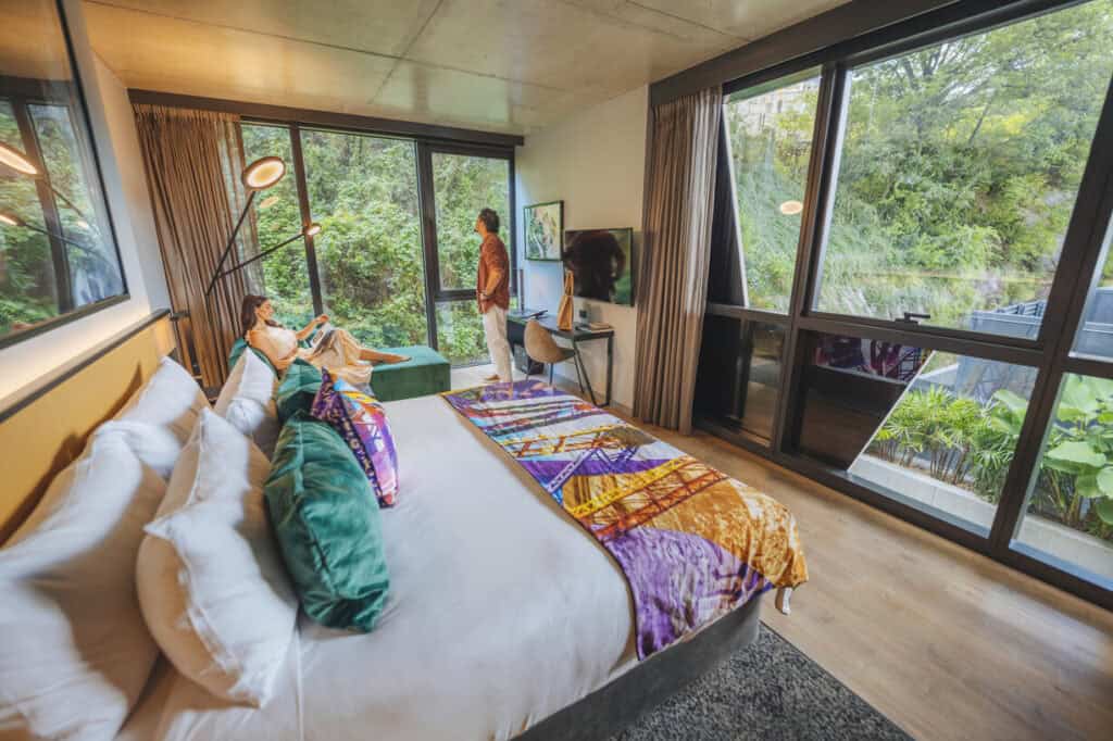 Couple relaxing in a Nature Wall room at Crystalbrook Vincent