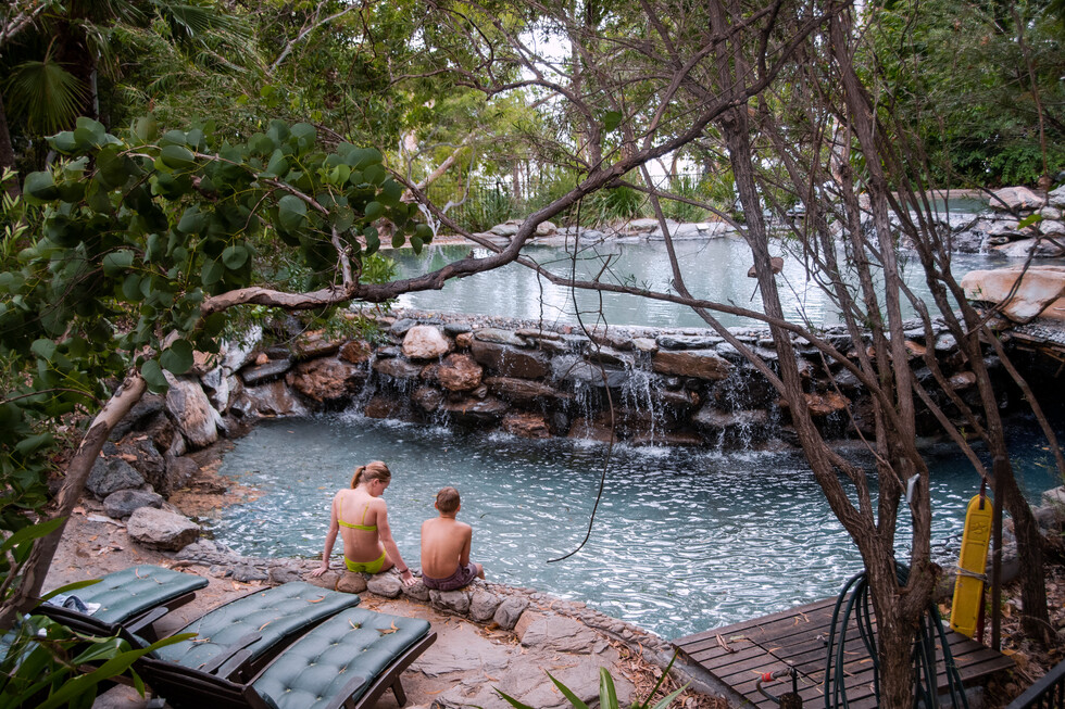 Children relaxing beside the pool at Thala Beach Nature Reserve