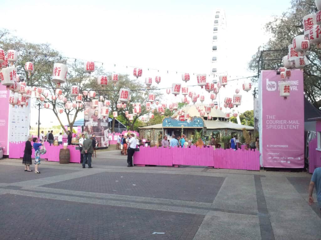 exterior courtyard with lantern decorations and circus tent