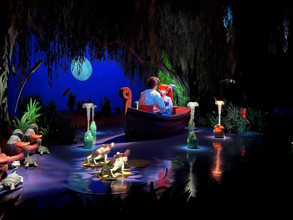 animatronic figures of ariel and eric in boat scene on little mermaid ride