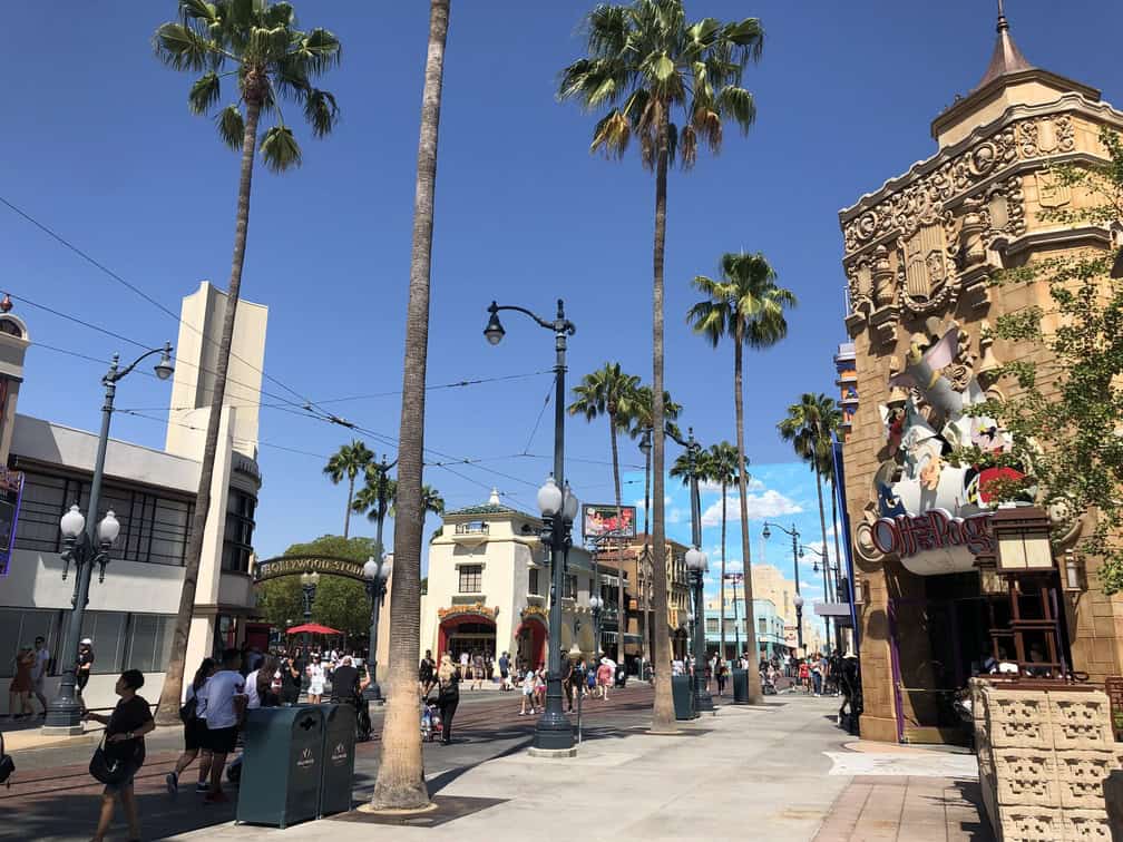 view down buena vista street of california adventure park with stores on both sides